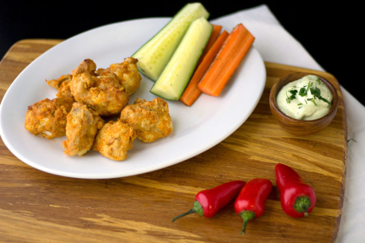 vegan cauliflower wings with peppers and vegan ranch
