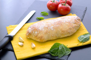 cutting the homemade ciabatta bread