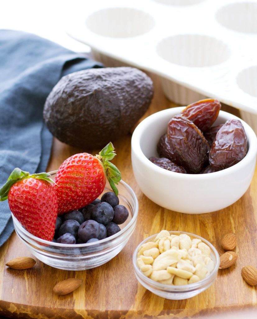 Vegan chocolate cheesecake ingredients- berries, cashews, almonds, dates and berries!