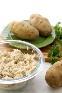 Shredded russet potatoes for vegan hash brown waffles