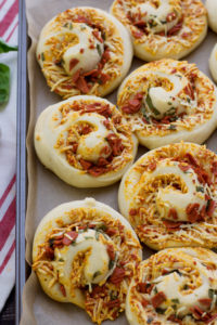 baked vegan pizza rolls on tray