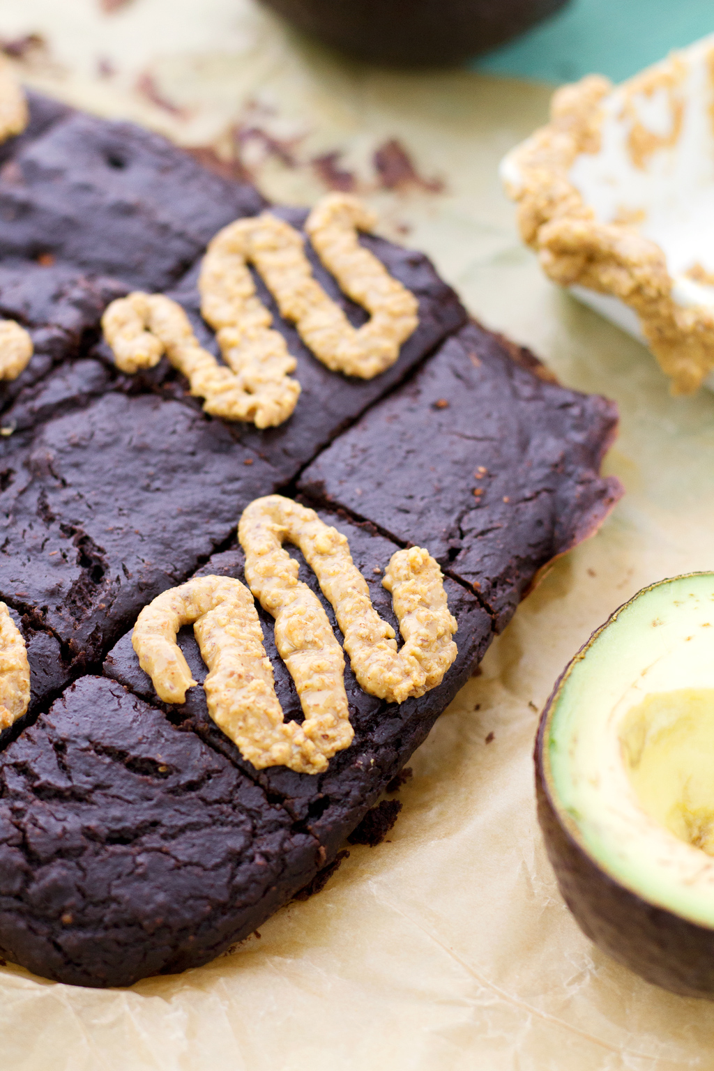 Avocado brownies covered in almond butter