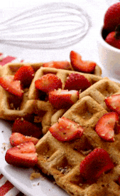 Pouring maple syrup on easy vegan waffle recipe 