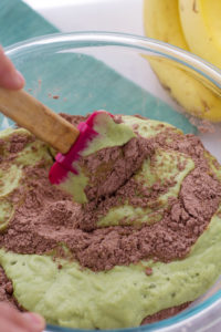 mixing vegan avocado brownies