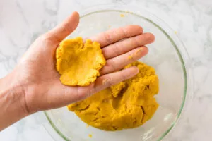 easiest vegan corn dog recipe: coating each piece
