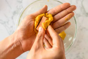 easiest vegan corn dog recipe: coating each piece