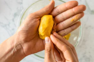 easiest vegan corn dog recipe: coating each piece