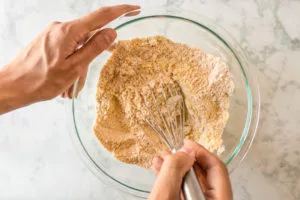 easiest vegan corn dog recipe: whisking the dry ingredients together