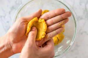 easiest vegan corn dog recipe: coating each piece