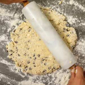 rolling out vegan chocolate chip scone recipe dough