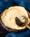 Copycat dole whip smoothie bowl filled in coconut bowl