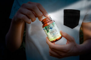 Opening bottle of vegan, plant-based d3 supplement